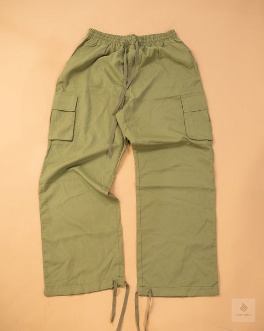 khaki green cargo pants featuring side pockets, a drawstring waist, and adjustable ankle ties
