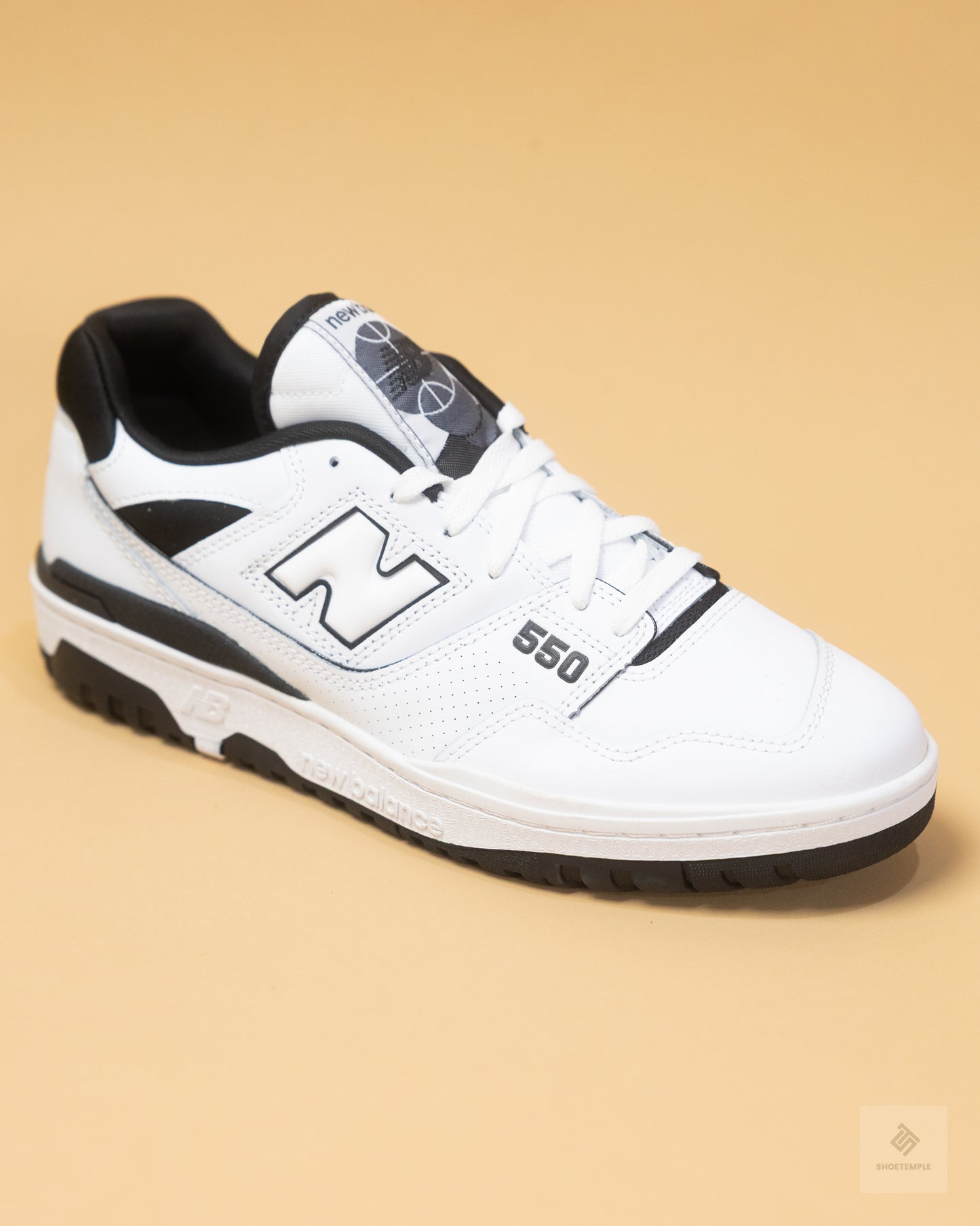 New Balance 550 sneakers in white and black