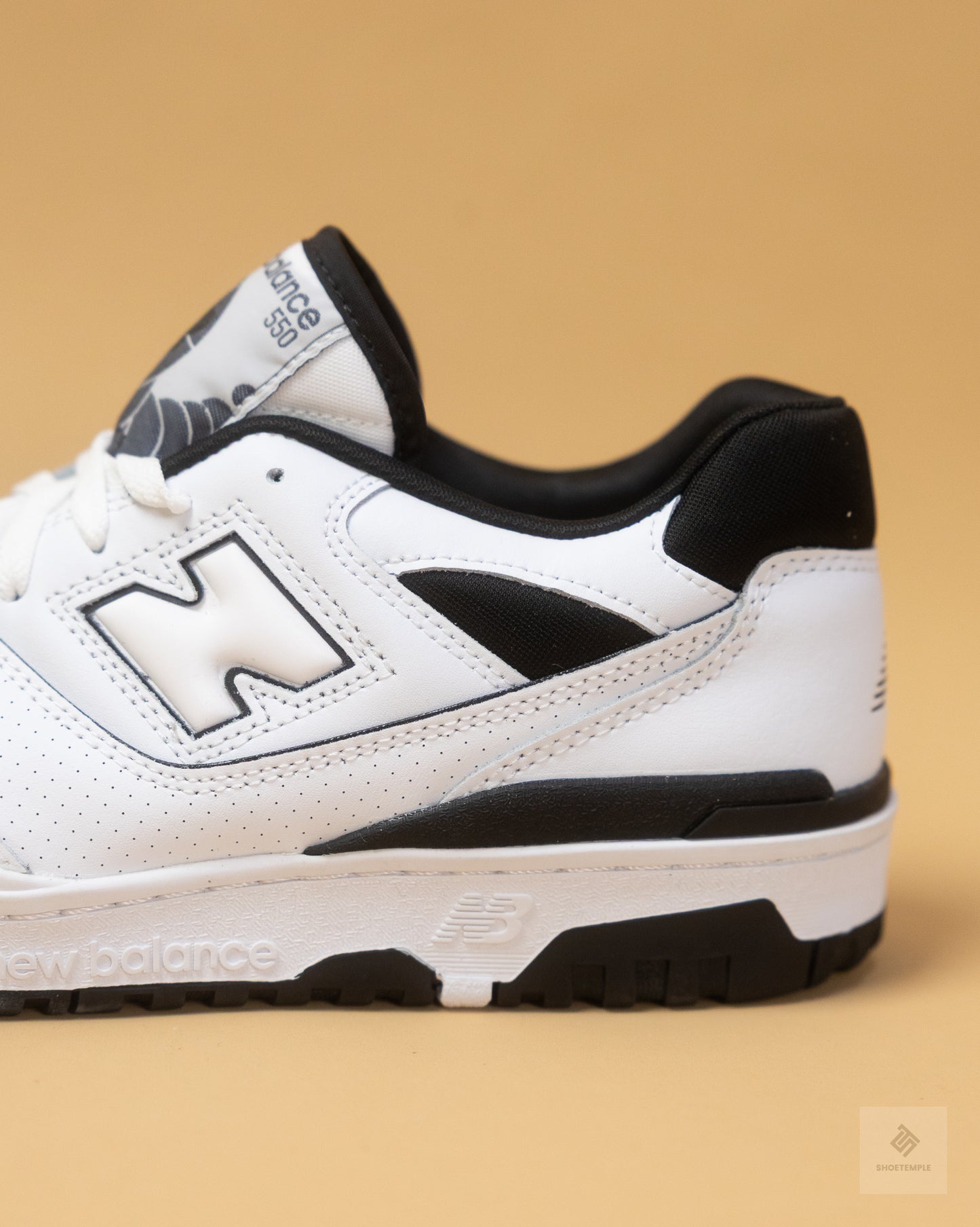 New Balance 550 sneakers in white and black