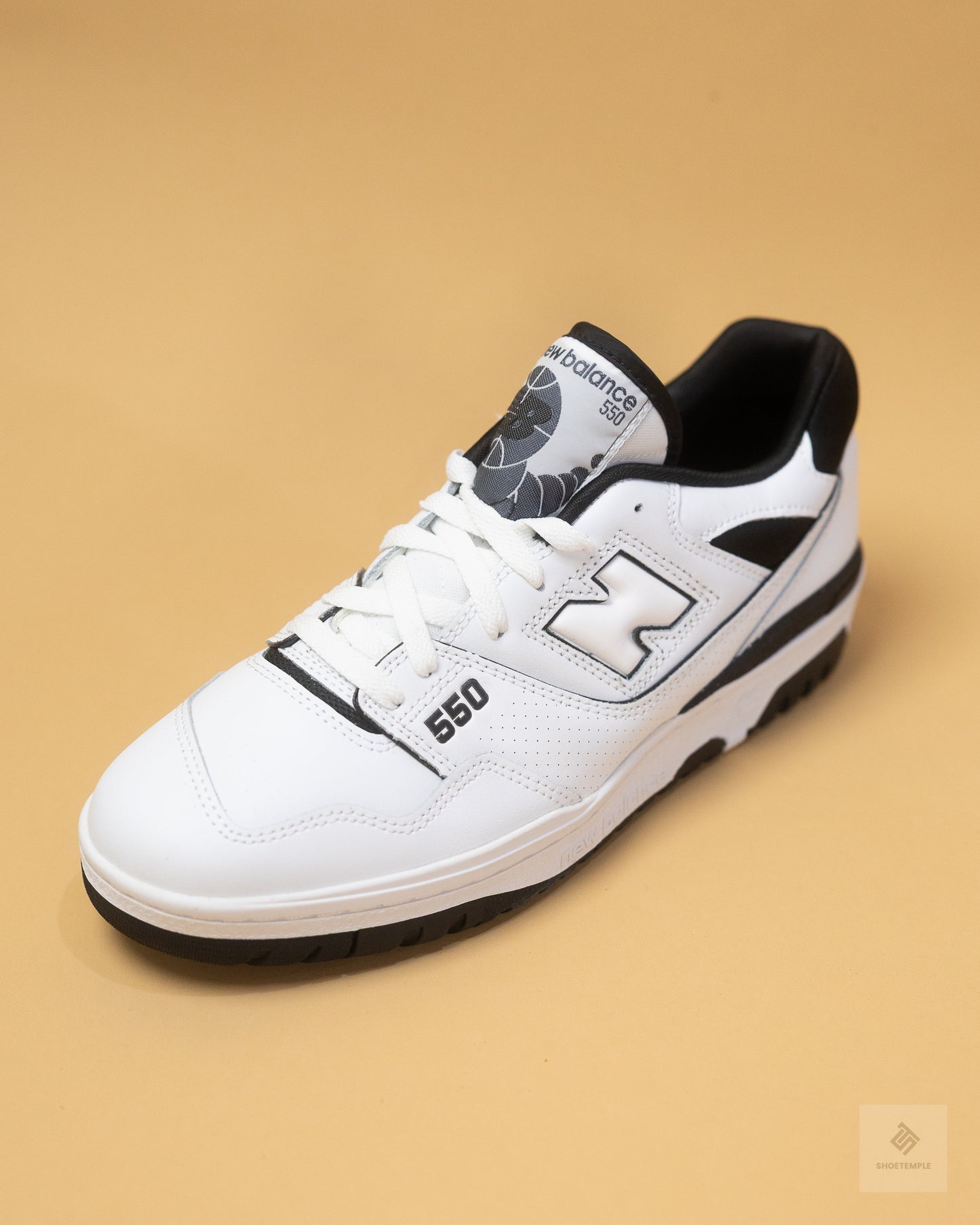 New Balance 550 sneakers in white and black